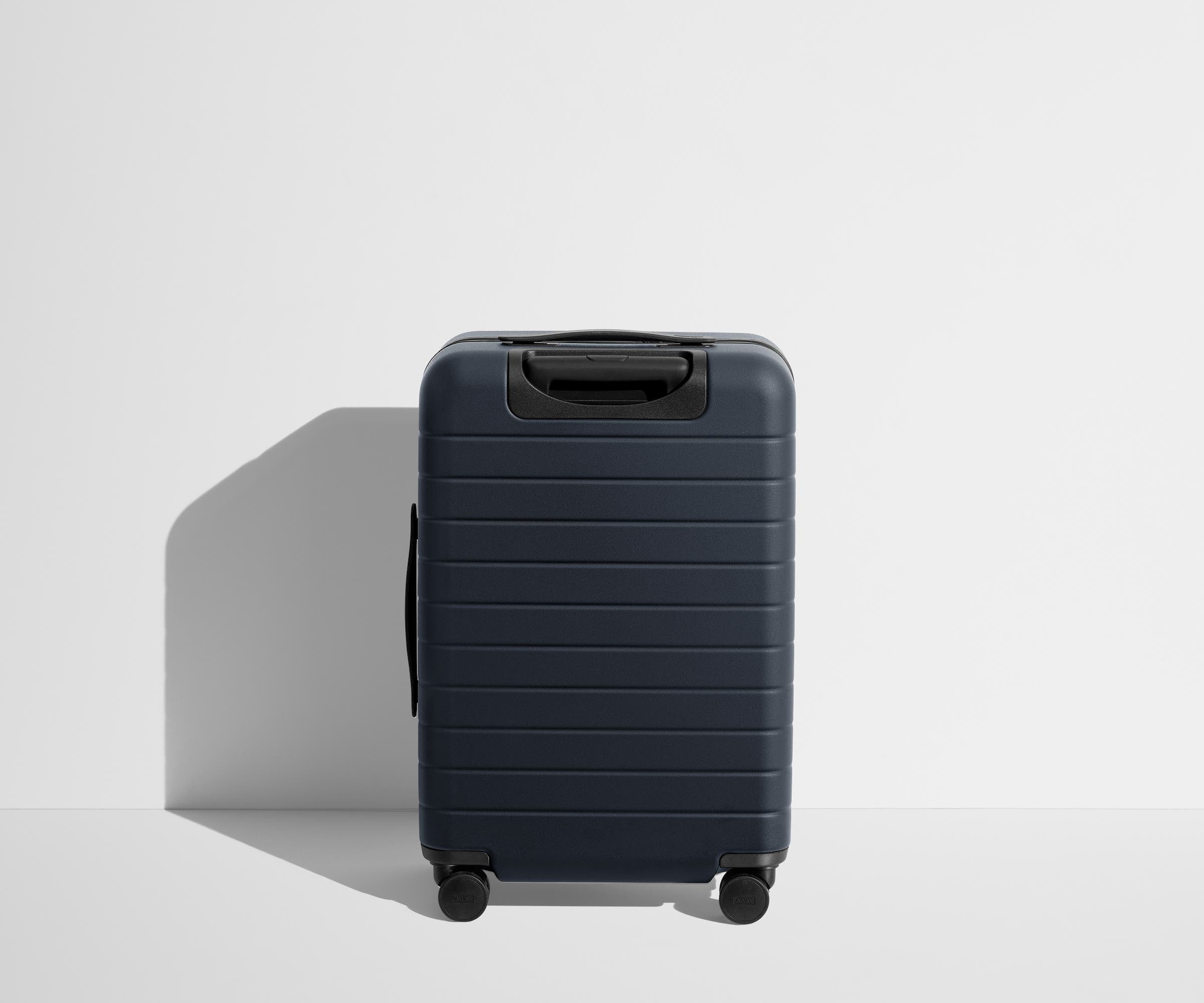 Away The Collegiate Bigger Carry-On Suitcase - UConn ®