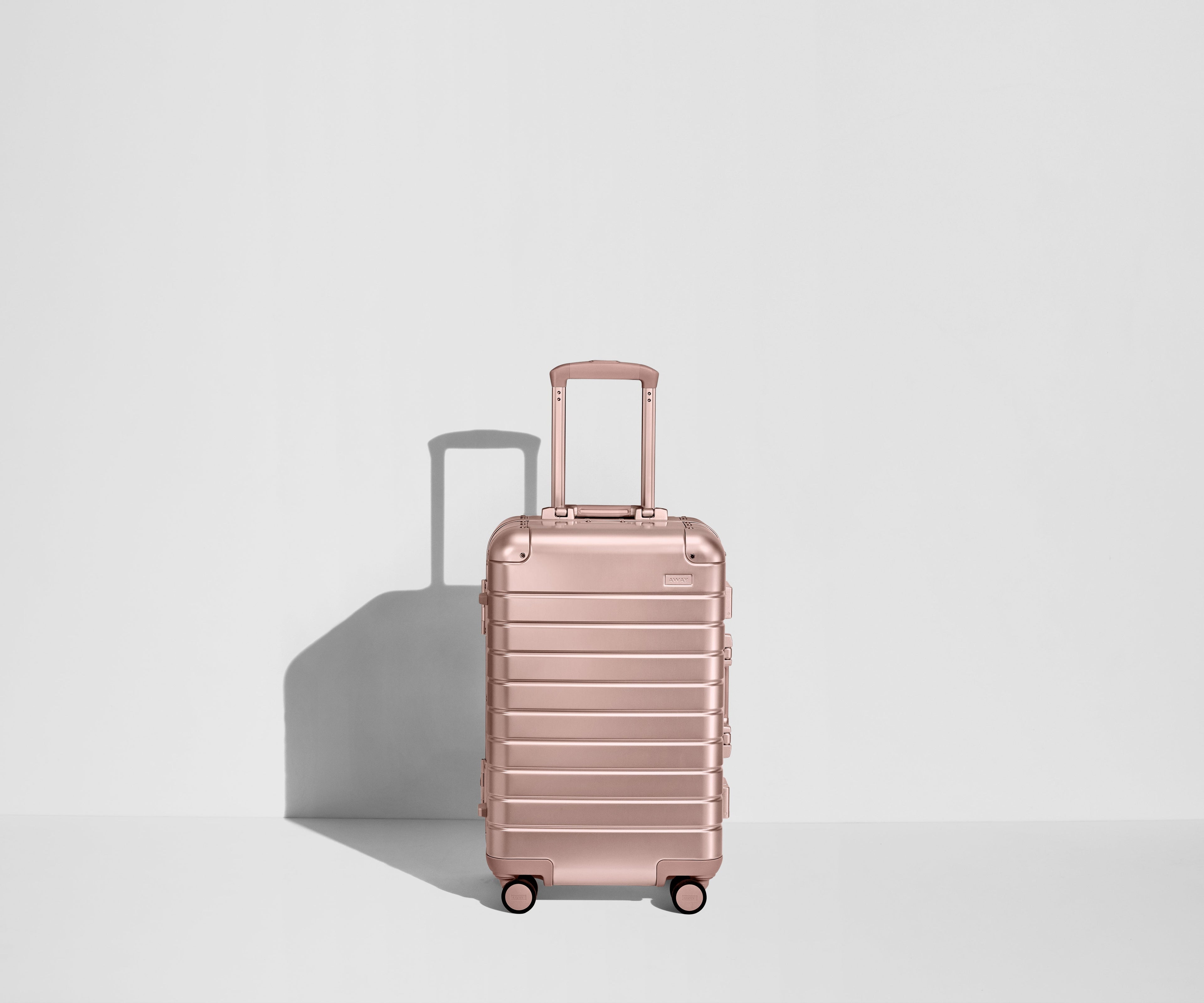 Away The Bigger Carry-On: Aluminum Edition Suitcase - Rose Gold (with USB charger)