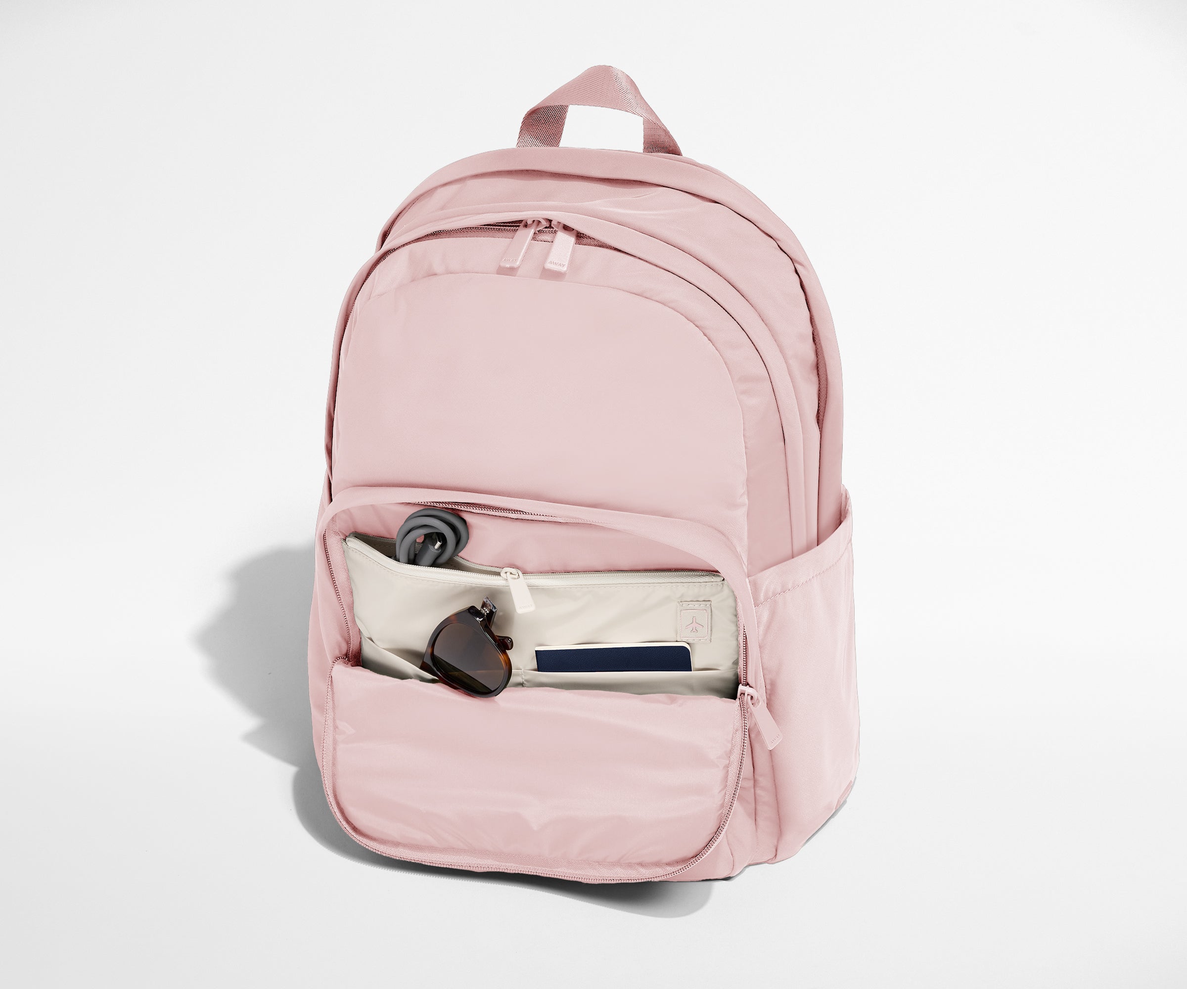 Away Large Featherlight Backpack in Blush Pink